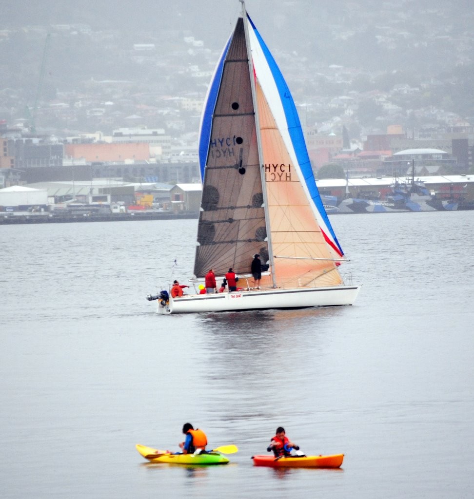 The Saint (John Lewis) sails slowly past Bellerive on the River Derwent in Group 4, finishing third in the race - Combined Club Harbour Series 2011 © Rob Cruse